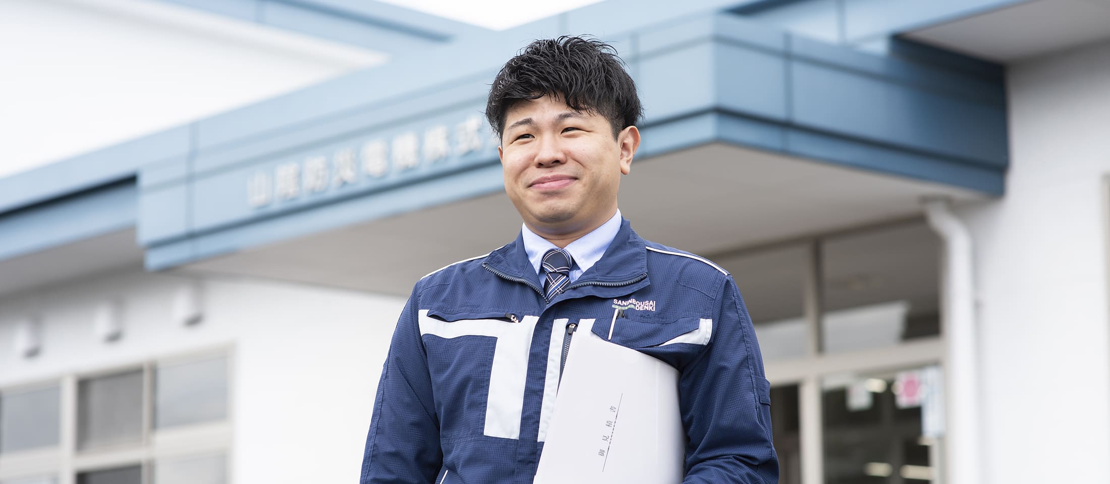 会社入口での写真